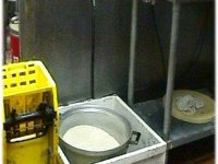 Cooked rice being stored in the mop sink.